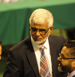 Former Sandwell Council deputy leader Mahboob Hussain, centre