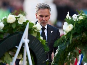 Netherlands Prime Minister Dick Schoof lays a wreath during a service to commemorate the war dead in Amsterdam