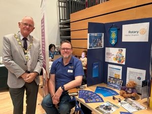 Mayor Roy Aldcroft (left) at the Rotary stand.