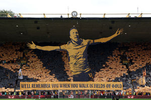 Fans of Wolverhampton Wanderers show a tribute in memory of Diogo Jota and his brother Andre Silva, with the words "We'll remember you when you walk in fields of gold" during the Premier League match between Wolverhampton Wanderers and Manchester City at Molineux (Photo by Michael Regan/Getty Images)