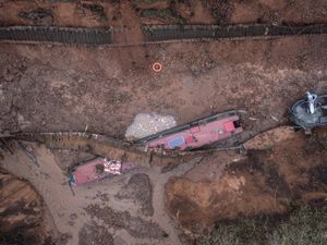 Three boats became caught up by the 50-square-metre sinkhole which developed at 4.22am today. Photo: Tom Maddick/SWNS