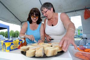 Kate Smith and Lol Barnes prepare snacks in the food tent