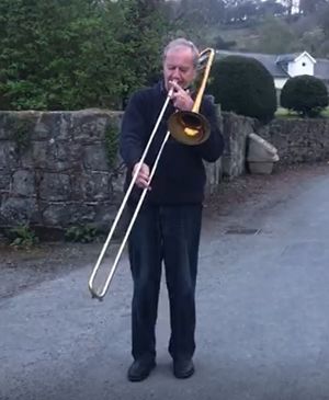 Mike Blakesley playing trombone for NHS heroes