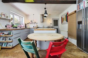 There is a large, modern fitted kitchen