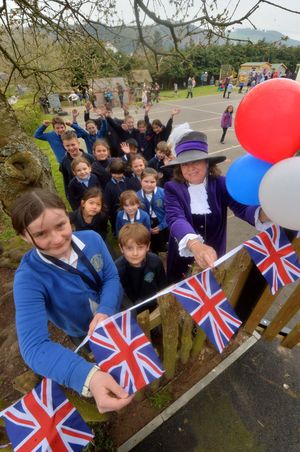 Newcastle CE School, where they and Clunbury CE School and St Marys School Bucknell, had come together for a Coronation party. The High Sheriff : Mandy Thorn was on hand to hand out a medal and party. At the front is: Maja Sharp 11 and Fynn McCabe 6..