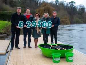  Glyn Jones, Technical Director, and Adrian Ellam, CEO of Invertek Drives Ltd reveal the amount raised with Jayney Davies, Chair of the organising committee, Katie Williams, Macmillan Regional Fundraising Manager, and Ron Gale of the organising committee. 