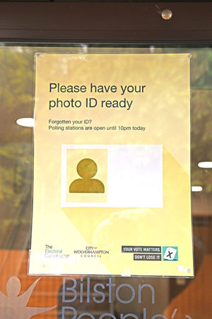A sign reminded voters to bring ID at a polling station in Bilston