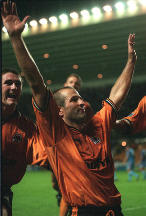 Robbie Keane joins in the celebrations as hat-trick hero Bully takes the acclaim of the Wolves fans.