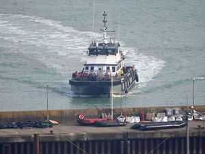 A boat bringing asylum seekers into Dover