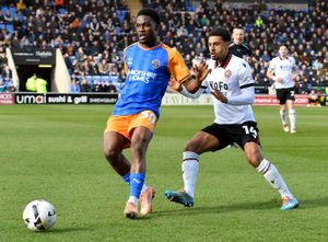 Shrewsbury Town's Kevin Berkoe and Walsall's Brandon Comley