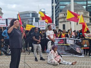 Leandra speaking at a protest in Centenary Square last month