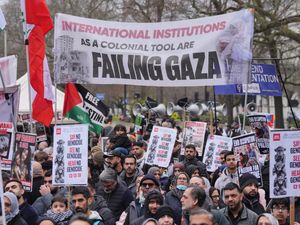 People take part in a pro-Palestine march