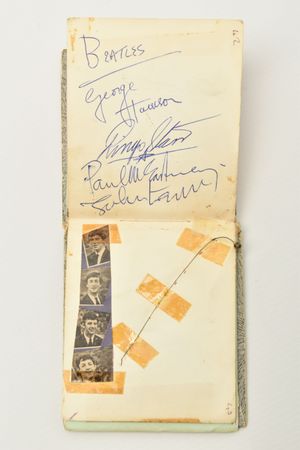 John Lennon, Paul McCartney, George Harrison and Ringo Starr signed after a gig in 1963. Affixed next to the autographs is George’s guitar string snapped that same night