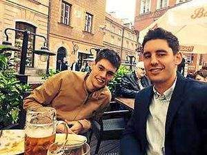 Will and a new friend drinking Polish beer at the Old Town square in Warsaw