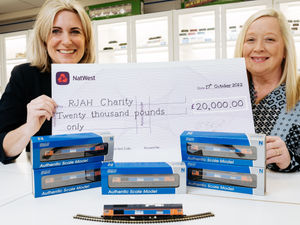 Supporting image for story: 'Chuffed!' Model trains named after Captain Sir Tom make £20,000 for hospital charity