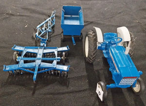 The Ertl Ford 4000 tractor and a selection of implements that sold for £150