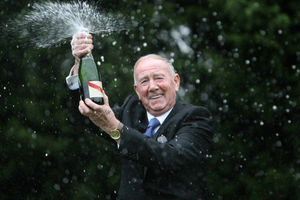 Vic Eden celebrates with Champagne