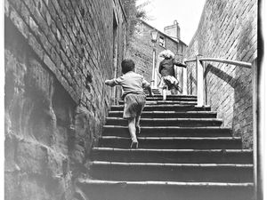 St Leonard's Steps, Bridgnorth, pictured in 1960. It is one of several sets of steps connecting the High Town and Low Town. The steps are named after St Leonard's Church in the High Town. The steps offer a good workout – or there is the easier choice of the Cliff Railway.
