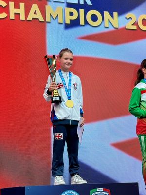Belle Greer with her gold medal and trophy in Italy