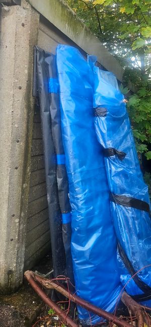 The 'dangerous' asbestos was wrapped in blue sheeting before being dumped on near residential addresses
