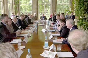 Sinn Fein President Gerry Adams (left) holds a bottle of water before he, British Prime Minister Tony Blair, Irish Prime Minister Bertie Ahern and other Ulster politicians start talks to advance the Northern Ireland peace process at Weston Park,