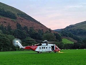 Coastguard helicopter at the foot of Cader Idris