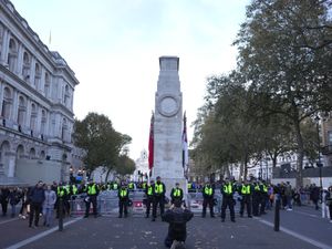 Metropolitan Police officers beside the Cenotaph in Whitehall, London, during a 2023 protest