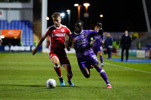 Jack Tucker and Daniel Udoh tussle for the ball