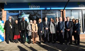 Guests celebrate the opening of the Tipton & Coseley Building Society in the
South Staffordshire village of Codsall

