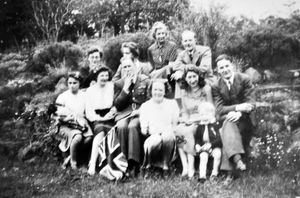 VE Day celebrations at The Old Hall, Dorrington, with Ursula Egerton Hine,  18, second from the left, above the flag. She is wearing a black  skirt made from blackout material with a bit of added braid. Sitting to her left is Marion Nellhaus, a Jewish refugee who had fled Germany 