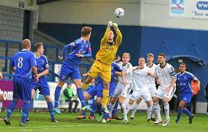 Matthew Urwin of Stalybridge Celtic punches clear this AFC Telford United corner