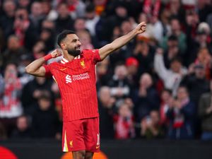 Mohamed Salah mimics firing an arrow from a bow