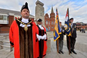 Mayor of Sandwell Richard Jones, Deputy Mayor Jackie Taylor and veterans Tony Cockerill and Keith Bojczuk from Oldbury observe the two-minute silence