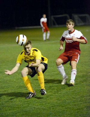 Ellesmere's Sean Griffiths and Wem's Chris Jeavons.
Elesmere in yellow
