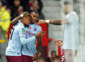Aston Villa's Leon Bailey celebrates their side's second goal of the game, an own goal scored by Manchester United's Diogo Dalot