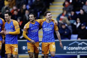 Iwan Morgan celebrates his first goal for Shrewsbury Town with his teammates