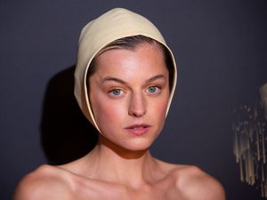 Supporting image for story: Emma Corrin swaps crown for a bonnet at Emmys red carpet