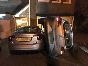 Supporting image for story: How's that for parking? Car left perched on its side on Wolverhampton driveway after crash