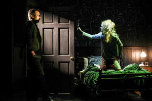 Joseph Wilkins as Father Joe and Clare Louise Connolly as Regan in The Exorcist