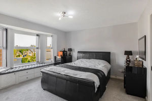 One of the large bedrooms feature a 'Juliet' balcony