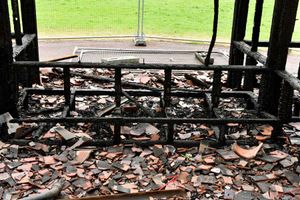 Charred debris in the aftermath