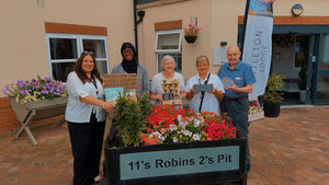 The team at HC-One’s Littleton Lodge Care Home with their gardening hamper prize 