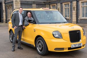Cllr Alan Bolshaw, chairman oWolverhampton Council’s licensing committee behind the wheel of the TX Electric taxi alongside Alastair Fairgrieve of the London Taxi Company, at Grand Station
 