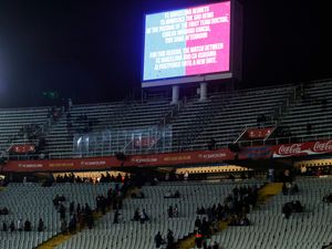 A screen informs fans of the postponement of Barcelona's game with Osasuna