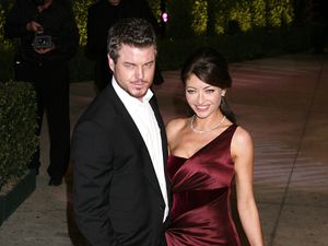 Eric Dane and his wife Rebecca Gayheart posing for a photo at a red carpet event