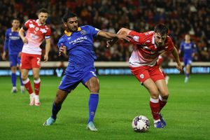 Mal Benning of Shrewsbury Town and Mael Durand de Gevigney of Barnsley (AMA)