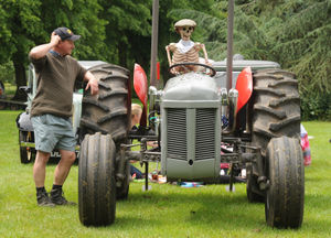 Sid Skeleton drives the Fast and Ferguson tractor, which belongs to (left) Kevin Norris, of Alveley