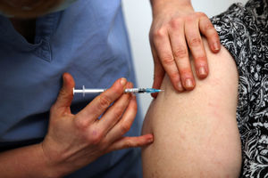 A patient receives an injection of the Pfizer-BioNTech coronavirus vaccine from Dr Jess Harvey at the Northgate Health Centre in Bridgnorth