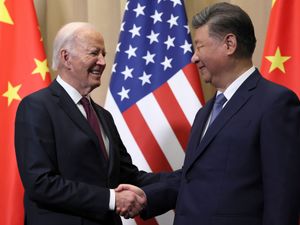 US President Joe Biden shakes hands with Chinese President Xi Jinping