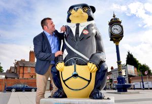 Councillor Richard Marshall with one of the bears one next to the bus station